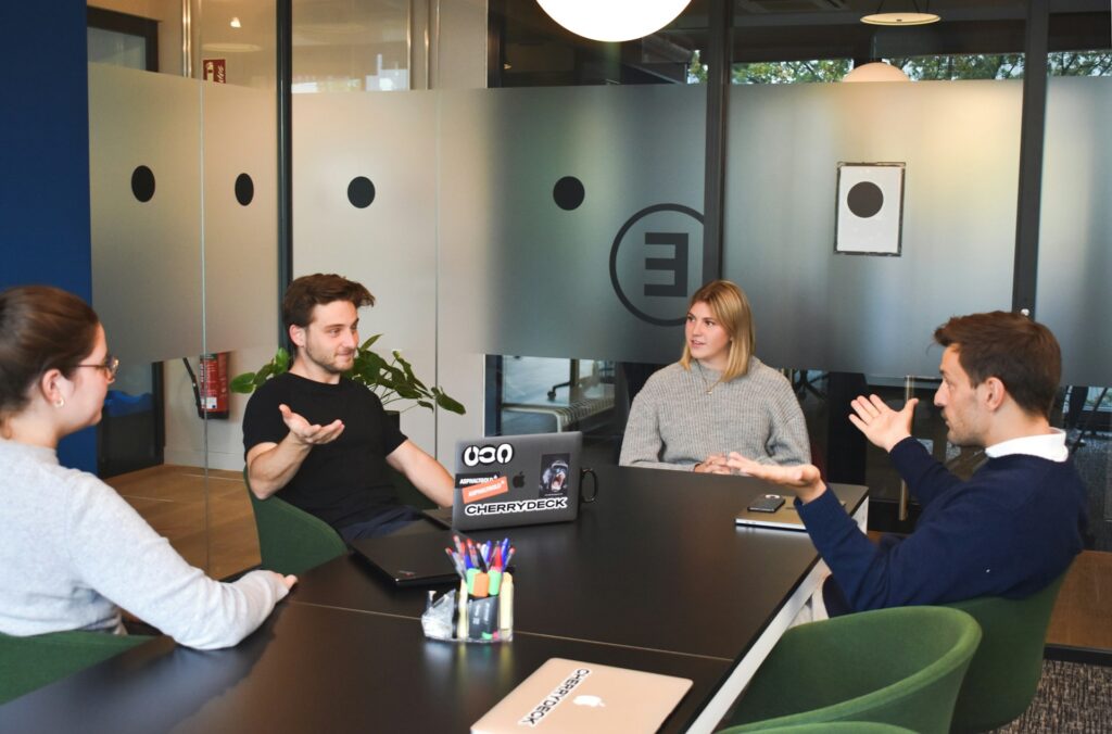 A group of colleagues meeting at the office.