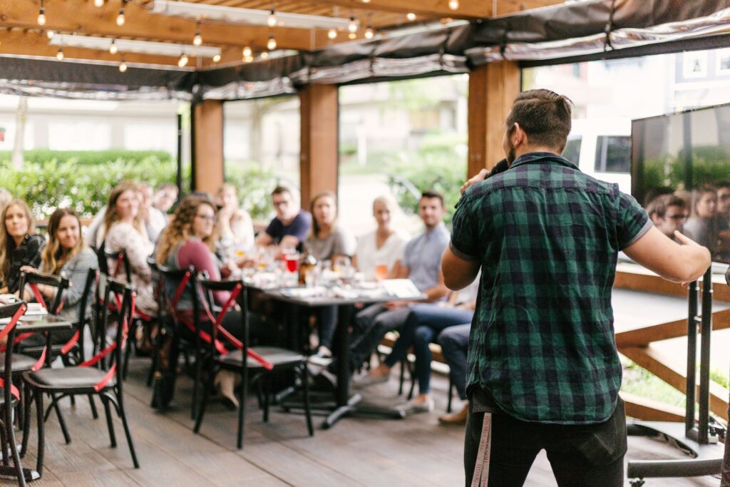 A man speaking to a crowd at an event with no fear.