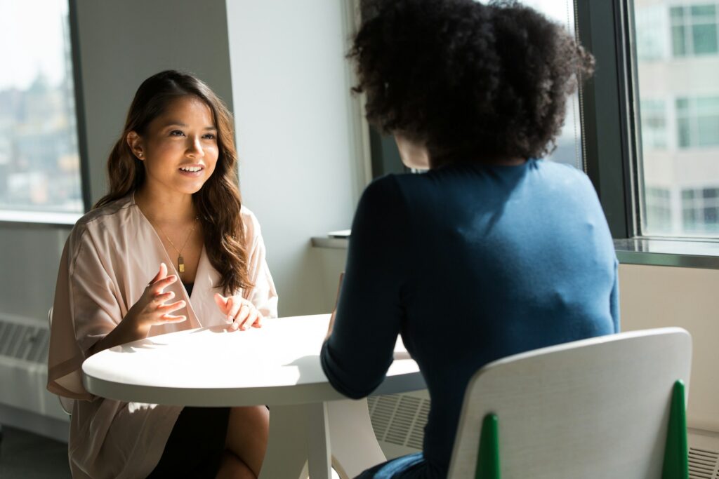 Two people having a conversation together.